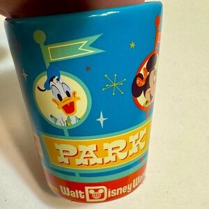 NWT. Disney Parks shot glass toothpick holder features Mickey Mouse and Goofy